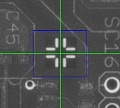 Registriermarke (Fiducial) wird automatisch über ein Kamerasystem erkannt.